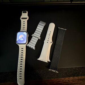 Apple Watch 8 bundle including 4 watch bands total and a Nomad charging pad.